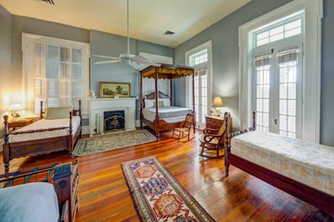 Four poster bed in nursery, two twin beds